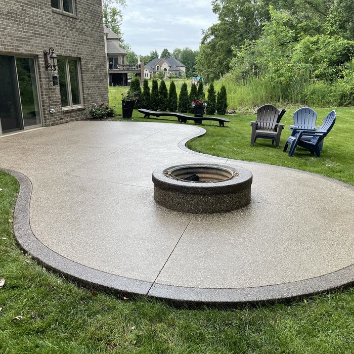 Exposed aggregate patio with fire pit, sealed